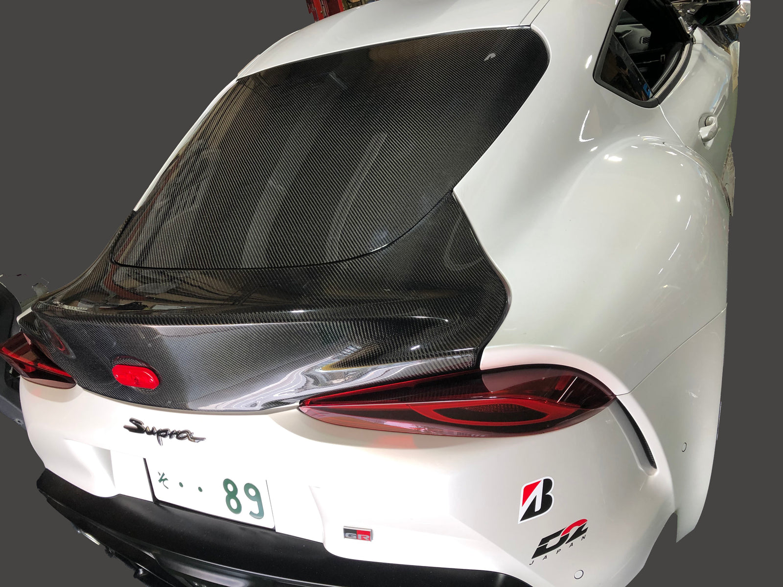 REVOLUTION REAR CARBON SMOOTHING GATE FOR TOYOTA SUPRA A90 A90-RCSG