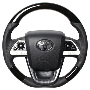 REAL ORIGINAL SERIES SET BLACK WOOD STEERING + BLACK CARBON PRINT UNDER PAD BLACK STITCH STEERING WHEEL FOR TOYOTA PRIUS 50  50-BKW-BK-BKT