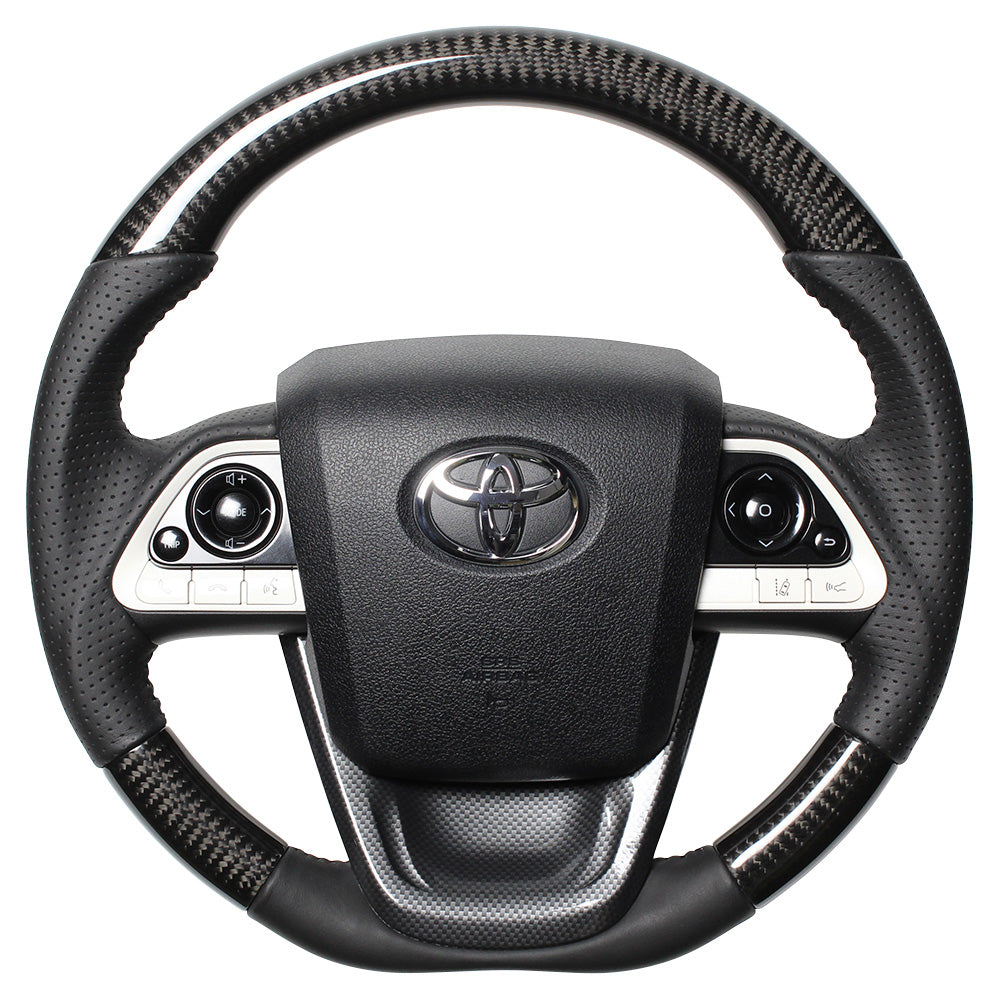 REAL ORIGINAL SERIES SET BLACK CARBON STEERING + BLACK CARBON PRINT UNDER PAD BLACK STITCH STEERING WHEEL FOR TOYOTA PRIUS 50  50-BKC-BK-BKT