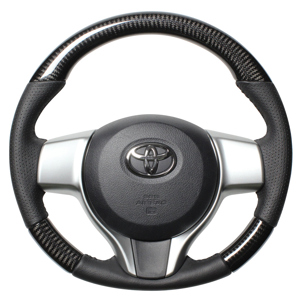 REAL ORIGINAL SERIES SOFT D SHAPE BLACK CARBON BLACK STITCH STEERING WHEEL FOR TOYOTA VITZ 130 EXCLUDING F GRADE P130-BKC-BK