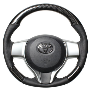 REAL ORIGINAL SERIES SOFT D SHAPE BLACK CARBON BLACK STITCH STEERING WHEEL FOR TOYOTA VITZ 130 EXCLUDING F GRADE P130-BKC-BK