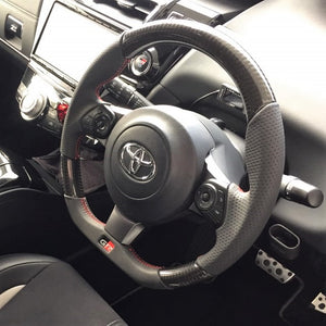 REAL ORIGINAL SERIES EMBLEM TYPE D SHAPE BLACK CARBON SILVER X BLACK EURO STITCH STEERING WHEEL FOR TOYOTA PRIUS Α GR SPORT 40  GRM-BKC-SL