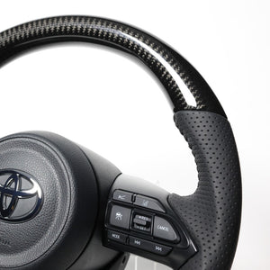 REAL ORIGINAL SERIES D SHAPE BLACK CARBON BLACK STITCH STEERING WHEEL FOR TOYOTA AQUA GR SPORT MXPK11  TYJ-BKC