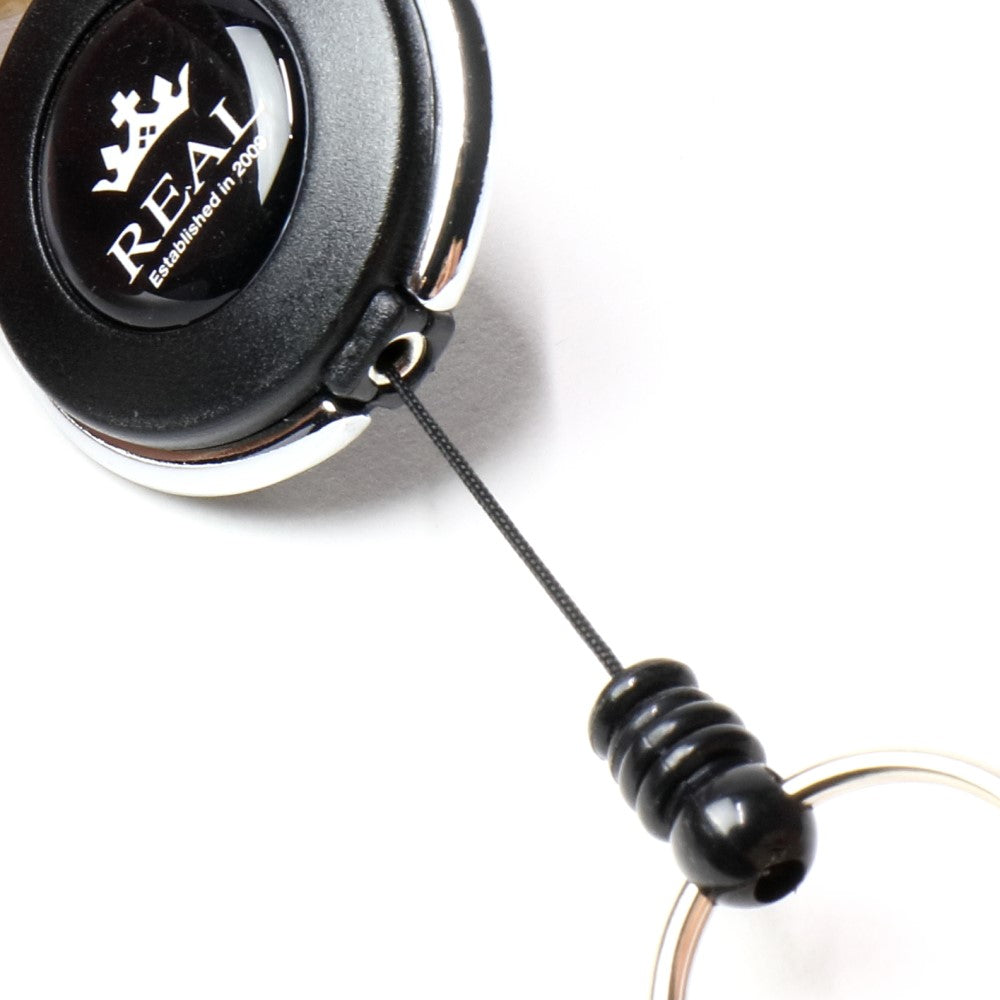 REAL REEL KEYCHAIN WITH REAL LOGO SMALL BLACK REAL-REEL-BK