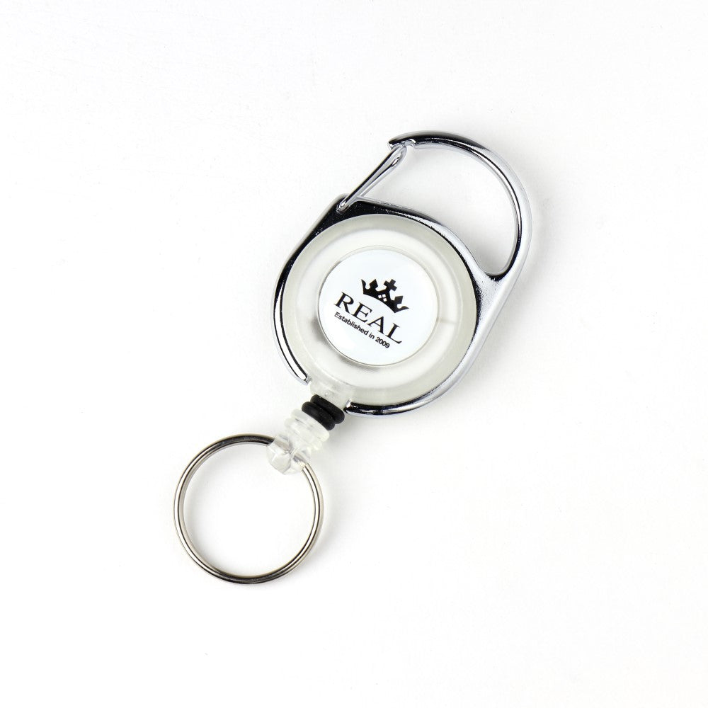 REAL REEL KEYCHAIN WITH REAL LOGO SMALL WHITE REAL-REEL-WH