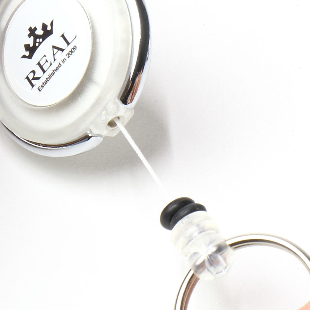 REAL REEL KEYCHAIN WITH REAL LOGO SMALL WHITE REAL-REEL-WH