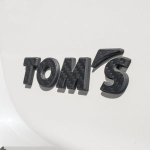 TOMS CARBON EMBLEM GLOSS FOR  08233-TS004